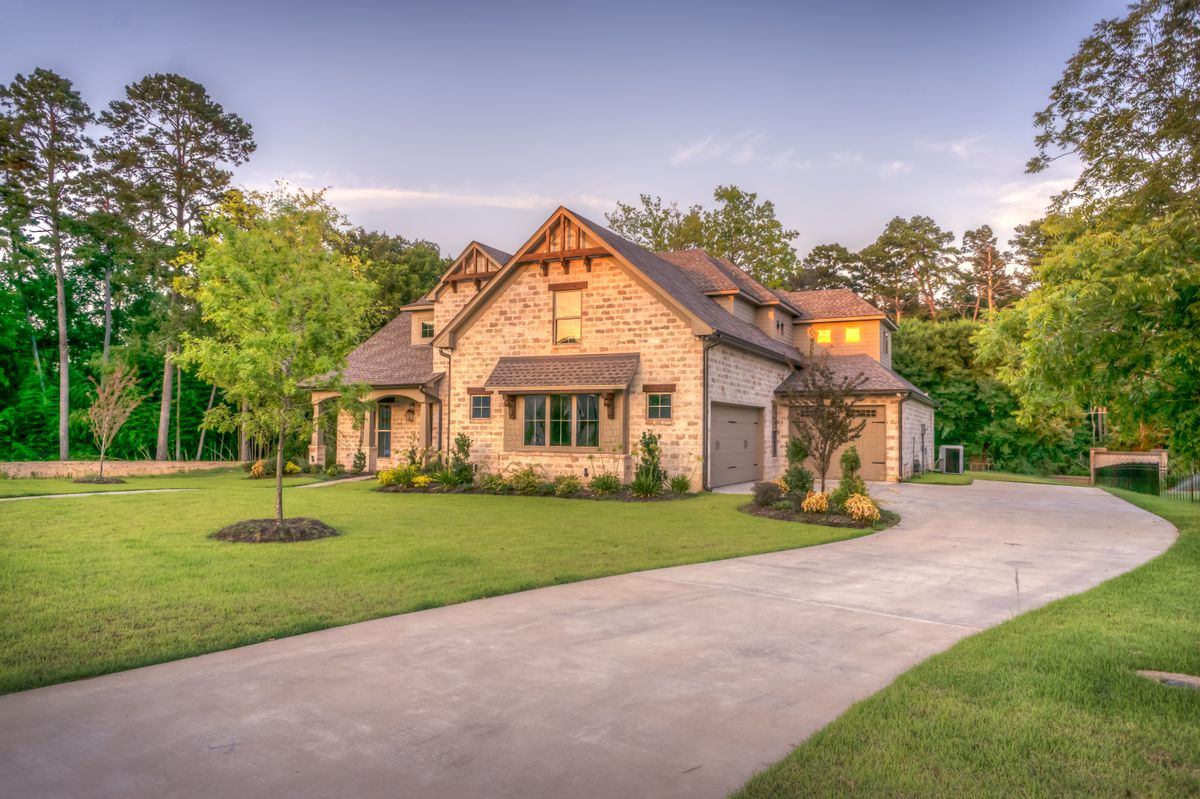 Finished residential concrete driveway at an upscale suburban home